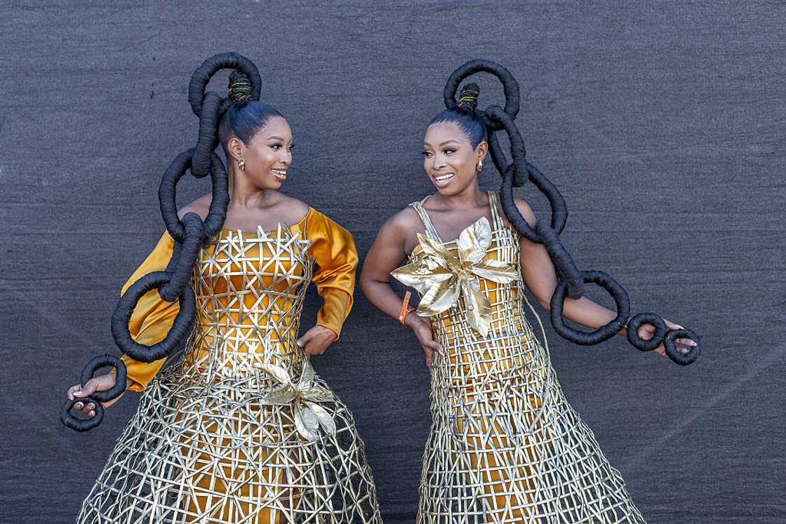 Twin sisters medical professionals turned reality television stars, Andile Piterson and Ayanda Mthembu step out in custom Neo Serati designs during a fashion show Twin sisters medical professionals turned reality television stars, Andile Piterson and Ayanda Mthembu step out in custom Neo Serati designs during a fashion show
