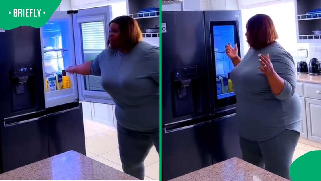 A lady dancing in front of new R100K fridge.