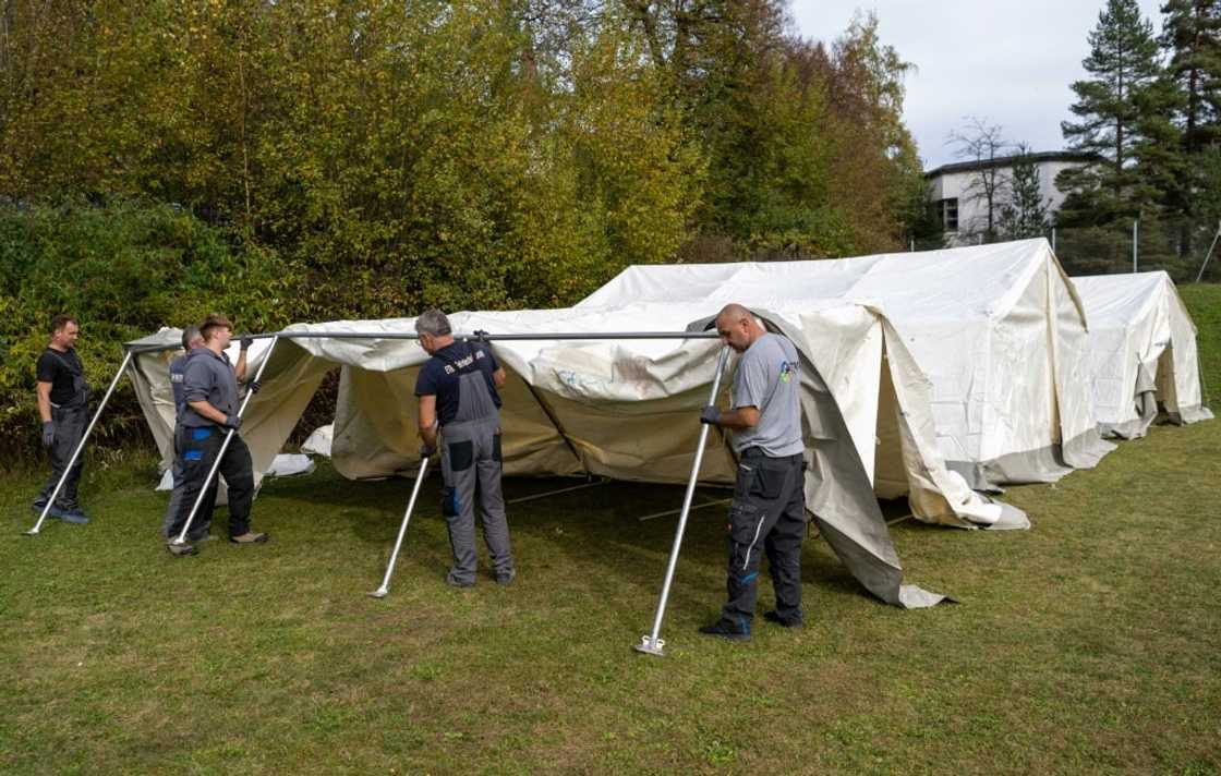 Workers assembles tents to house refugees in eastern Austria Workers assembles tents to house refugees in eastern Austria