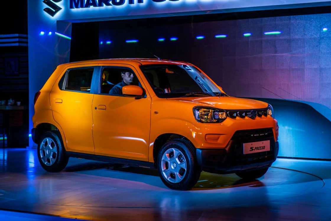 An orange Suzuki S-Presso An orange Suzuki S-Presso