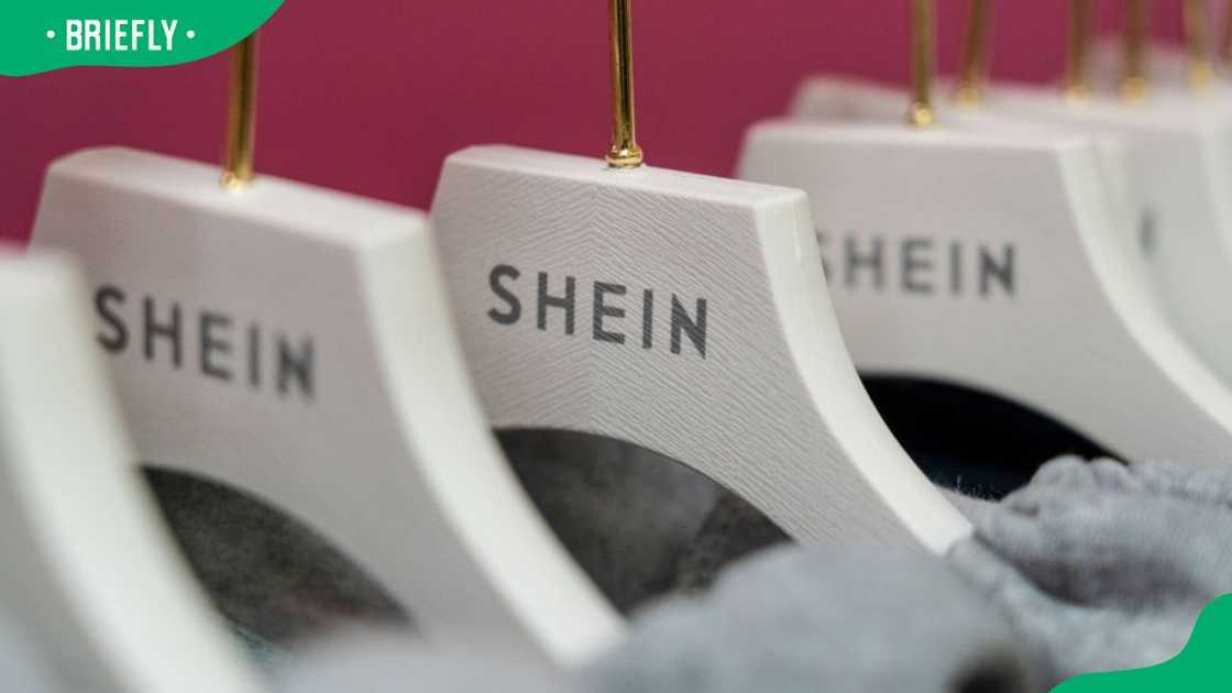 The Shein logo on hangers at the SheIn Group Ltd. pop-up store in the Jervis Shopping Centre