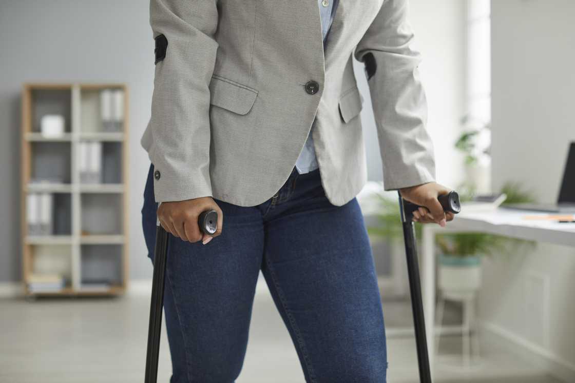 A woman with crutches A woman with crutches