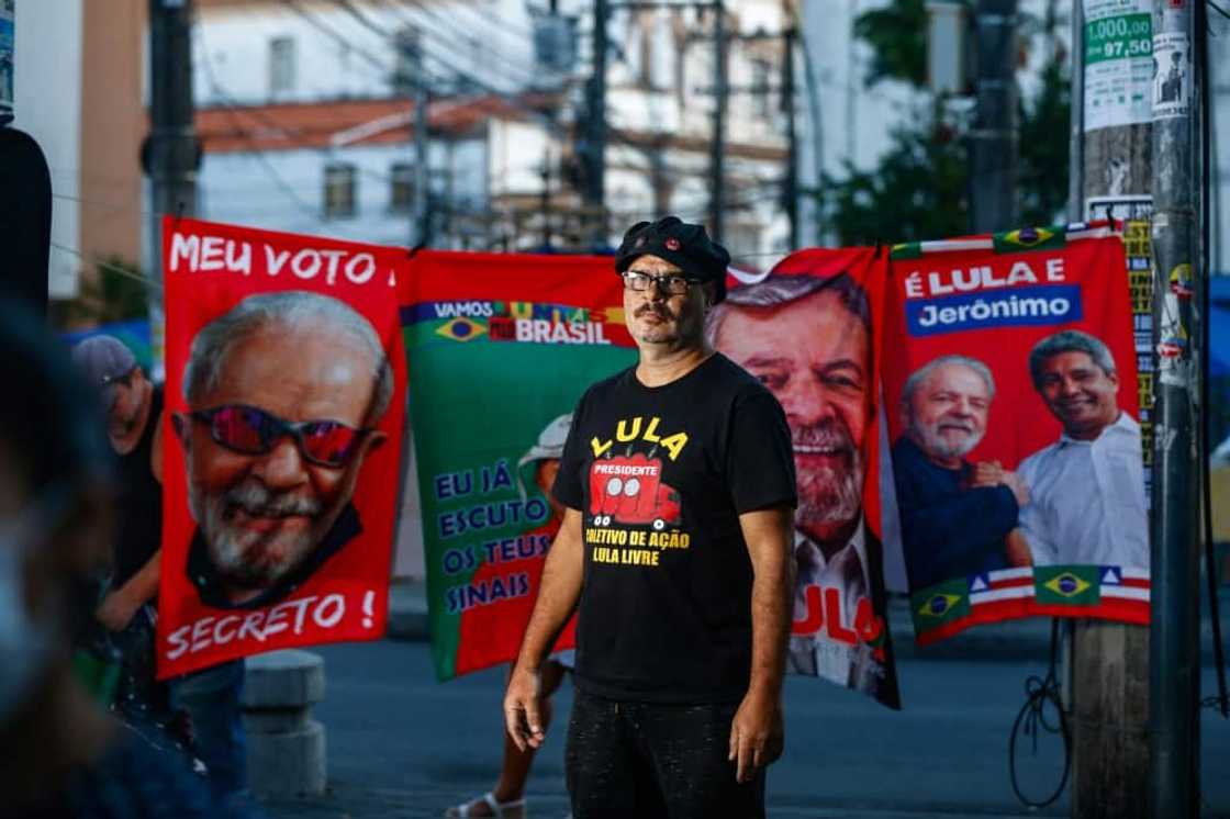 Messias Figueiredo, 56, is a well-known figure at left-wing protests -- instantly recognizable with his rectangular glasses and an ever-present red boom box emblazoned with Brazilian former president Luiz Inacio Lula da Silva's picture Messias Figueiredo, 56, is a well-known figure at left-wing protests -- instantly recognizable with his rectangular glasses and an ever-present red boom box emblazoned with Brazilian former president Luiz Inacio Lula da Silva's picture