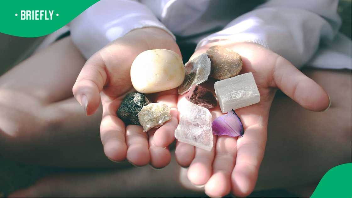 A stock photo of a woman holding gem stones