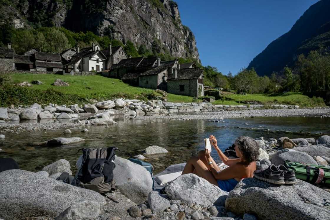 October sunbathing next to the tiny village of Roseto near Cevio October sunbathing next to the tiny village of Roseto near Cevio