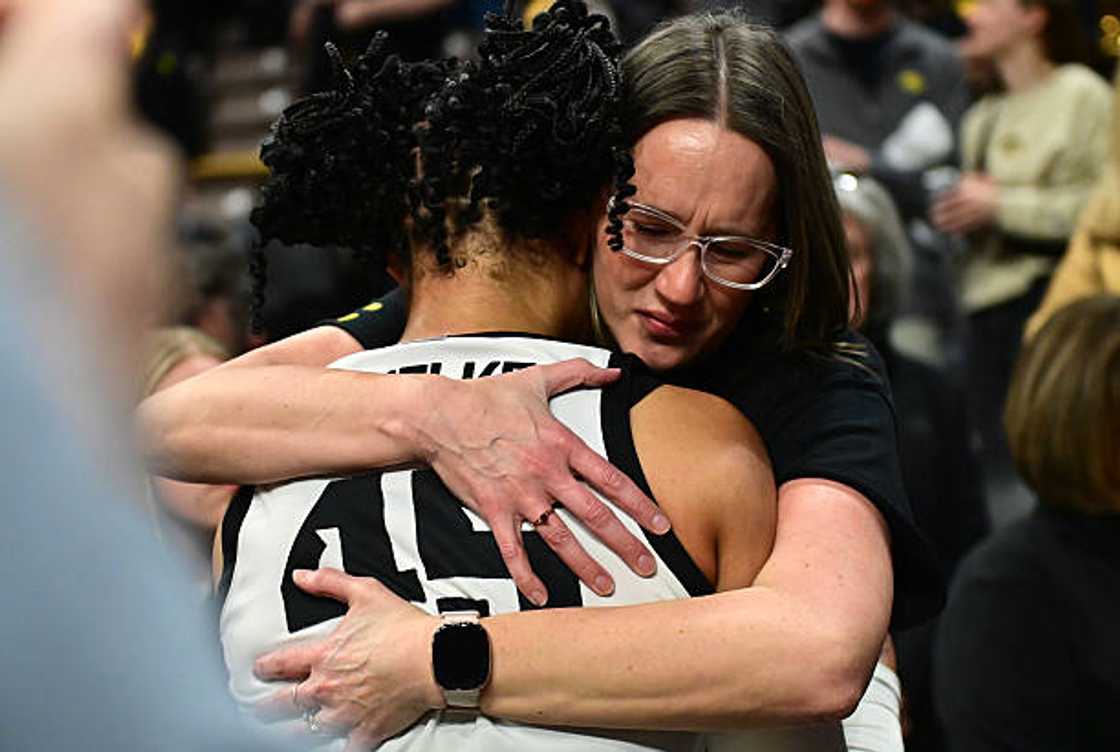 Iowa forward Hannah Stuelke gets a hug from her mother, JoAnna Mantz after losing to Virginia Cavaliers Iowa forward Hannah Stuelke gets a hug from her mother, JoAnna Mantz after losing to Virginia Cavaliers