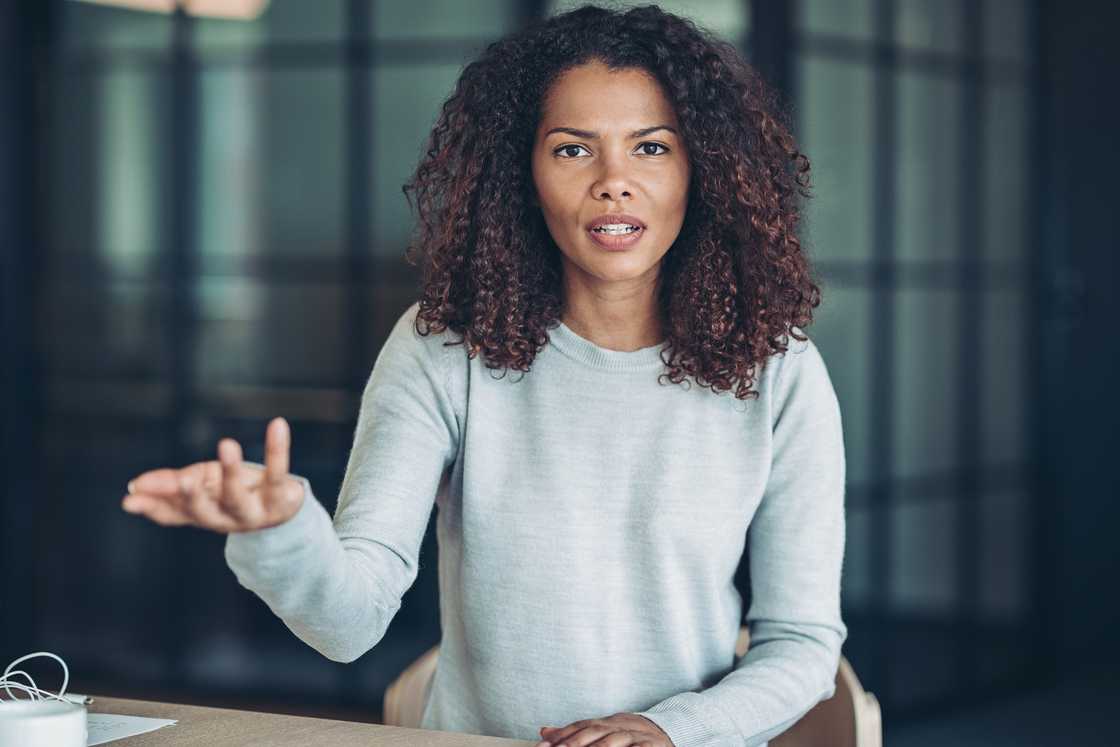 An upset woman gesturing An upset woman gesturing