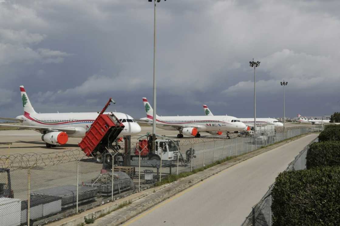 Lebanon's Middle East Airlines (MEA) planes are parked on the tarmac of Beirut International Airport amid restrictions to combat the coronavirus across the country on March 19, 2020. Lebanon urged people to stay at home for two weeks and closed the main airport to stem a novel coronavirus outbreak. Lebanon's Middle East Airlines (MEA) planes are parked on the tarmac of Beirut International Airport amid restrictions to combat the coronavirus across the country on March 19, 2020. Lebanon urged people to stay at home for two weeks and closed the main airport to stem a novel coronavirus outbreak.