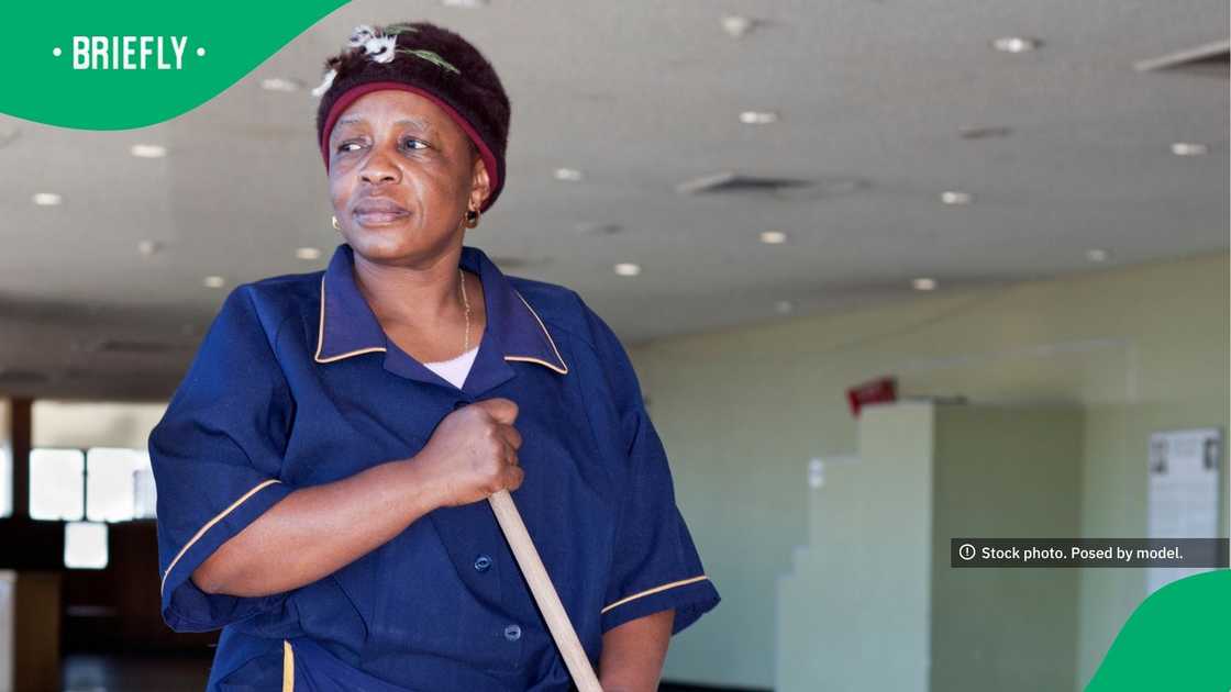 The image captured a cleaner wearing her work uniform The image captured a cleaner wearing her work uniform