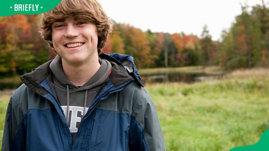 A high school student standing in the field A high school student standing in the field