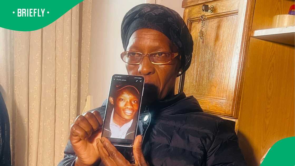 Sello Arthur Mohlabeng's mother, Noah Mohlabeng with a photo of her son Sello Arthur Mohlabeng's mother, Noah Mohlabeng with a photo of her son