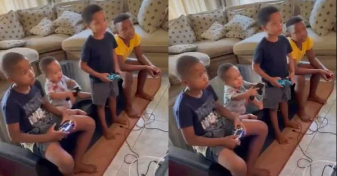 Siblings play cute console game control trick on fun loving toddler Siblings play cute console game control trick on fun loving toddler