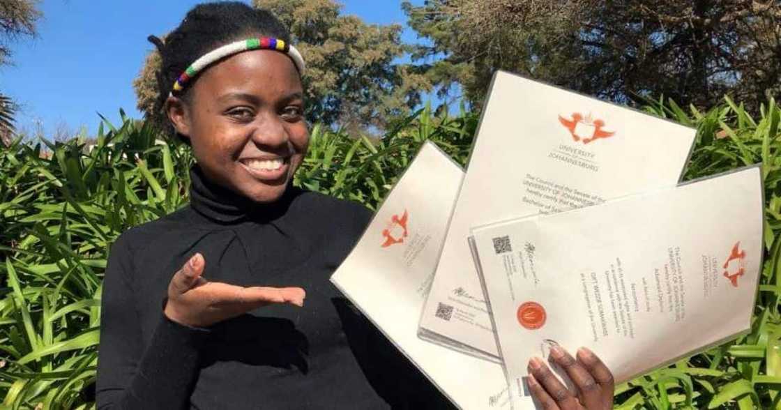 Young Woman, celebrates, bagging her third degree.