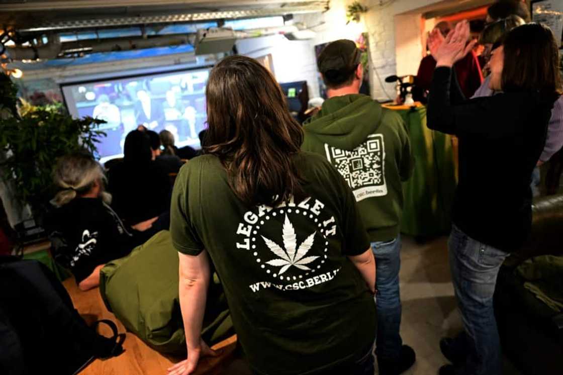 Staff members at the Hemp Museum in Berlin on Friday watching the parliament vote to legalise cannabis Staff members at the Hemp Museum in Berlin on Friday watching the parliament vote to legalise cannabis