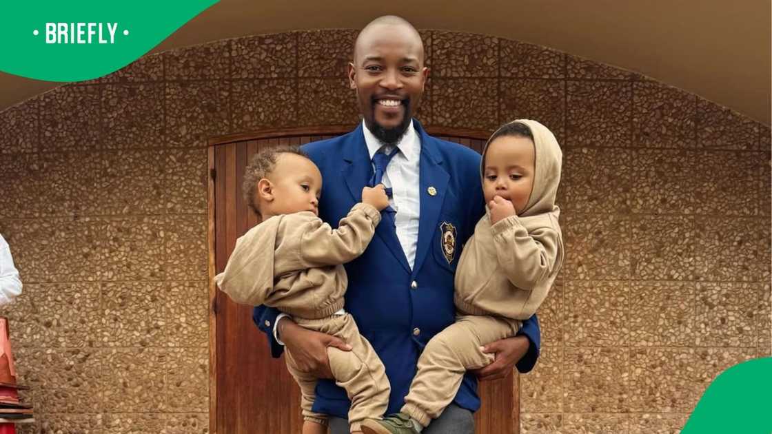 Moshe Ndiki with his twin sons Moshe Ndiki with his twin sons