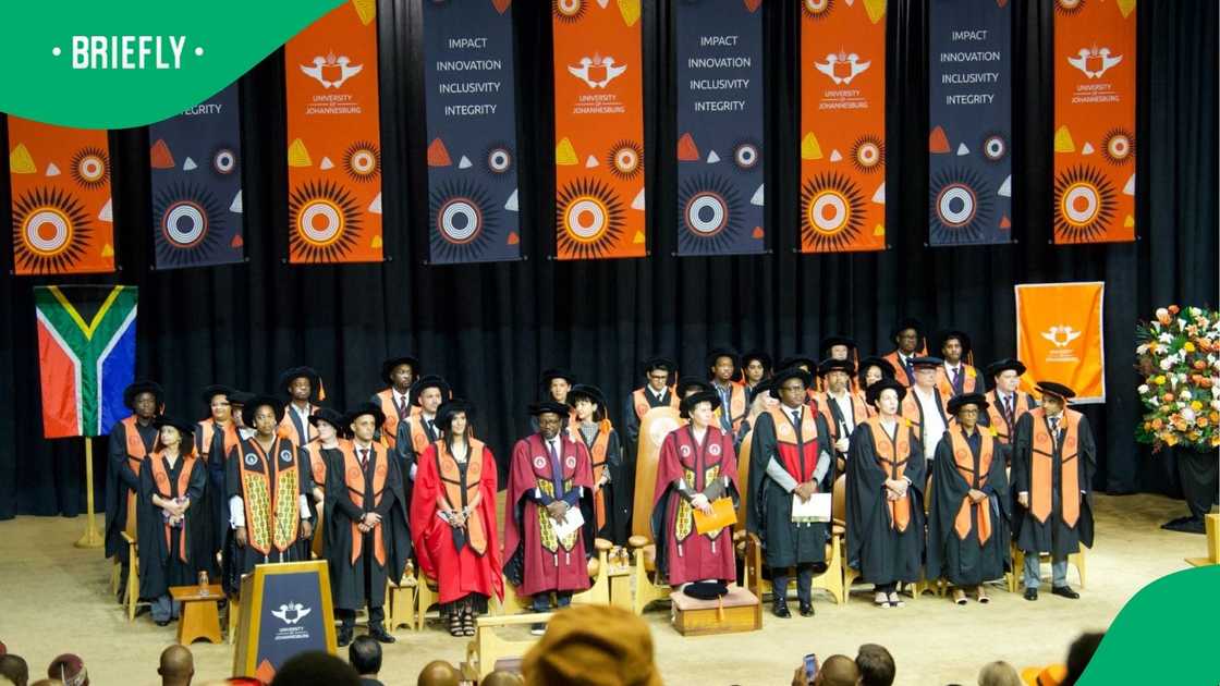 The visual showed graduates and vice chancellors on stage The visual showed graduates and vice chancellors on stage