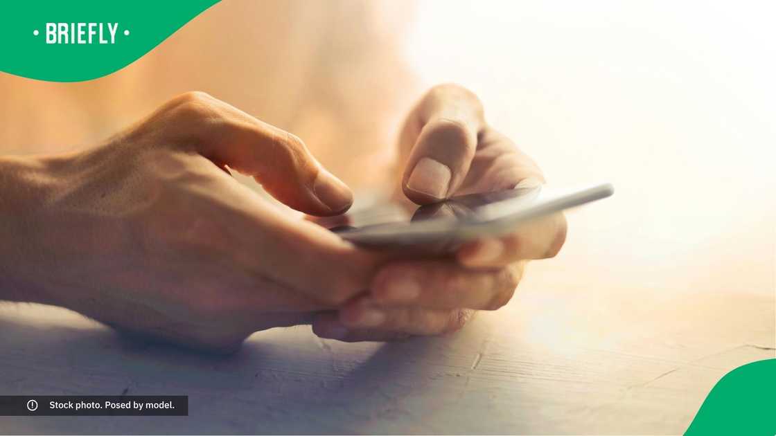 A person typing on their phone.