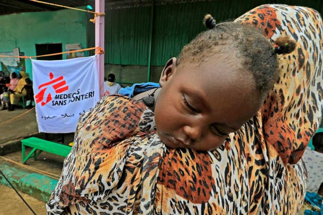 A family who fled clashes in Sudan's Blue Nile state last month wait at a clinic set up by health authorities in collaboration with Medecins Sans Frontieres A family who fled clashes in Sudan's Blue Nile state last month wait at a clinic set up by health authorities in collaboration with Medecins Sans Frontieres