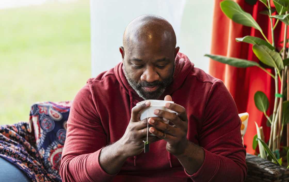 A man is taking tea in the morning A man is taking tea in the morning