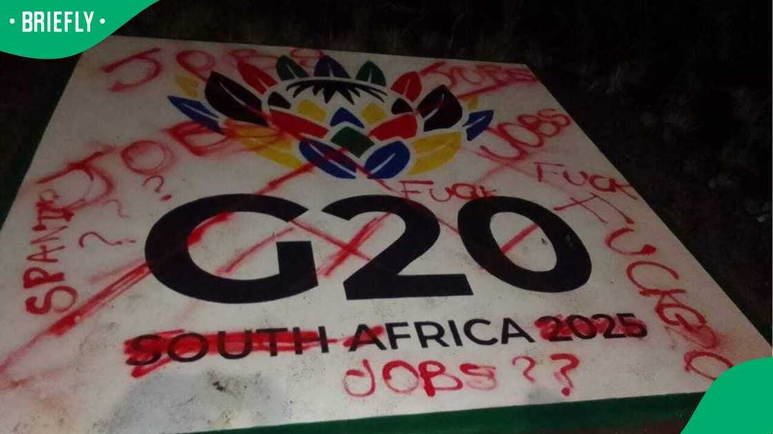 One of the G20 signs was spray-painted by vandals One of the G20 signs was spray-painted by vandals