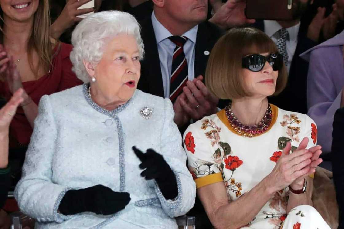 Queen Elizabeth II sits next to Vogue editor in chief Anna Wintour at London Fashion Week on February 20, 2018