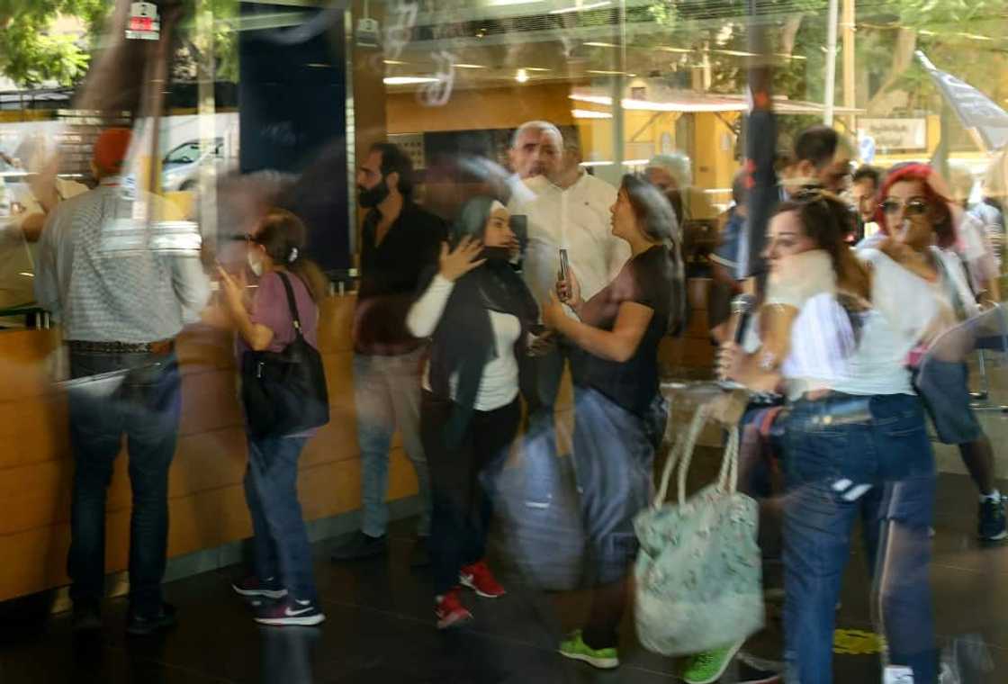 A woman held up a bank in Beirut on September 14, 2022, demanding access to her sister's deposits, one of a spate of such incidents in recent weeks A woman held up a bank in Beirut on September 14, 2022, demanding access to her sister's deposits, one of a spate of such incidents in recent weeks