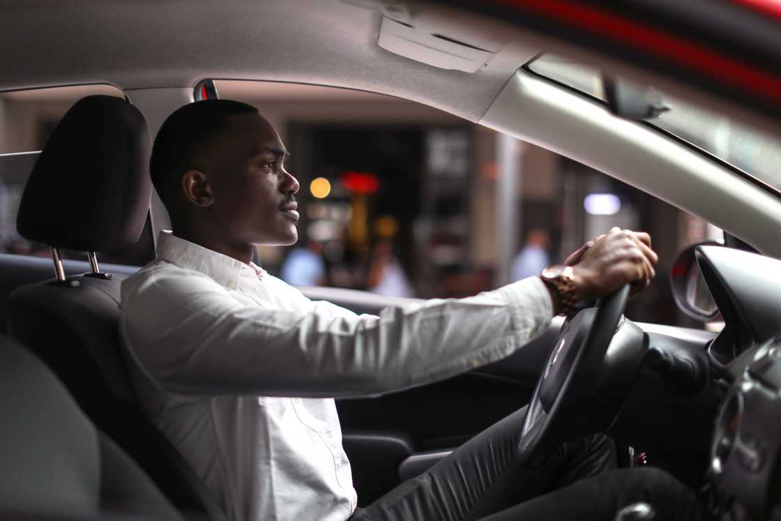 A young person in a car