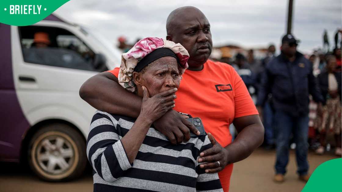 Devastated community members outside the scene of the mass shooting in Bekkersdal Devastated community members outside the scene of the mass shooting in Bekkersdal