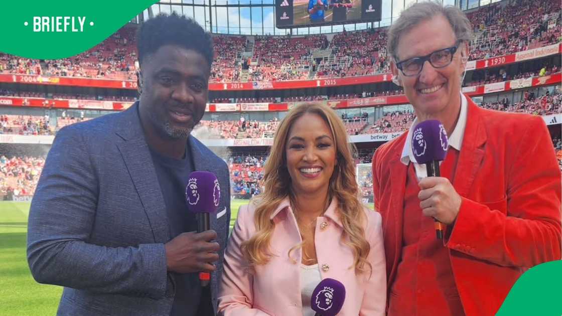 South African TV presenter stands in between Arsenal legends Kolo Toure and Tony Adams.