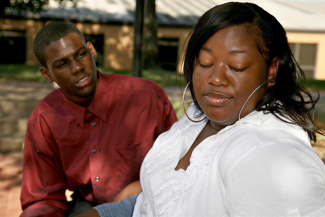 A man begging for forgiveness in an argument A man begging for forgiveness in an argument