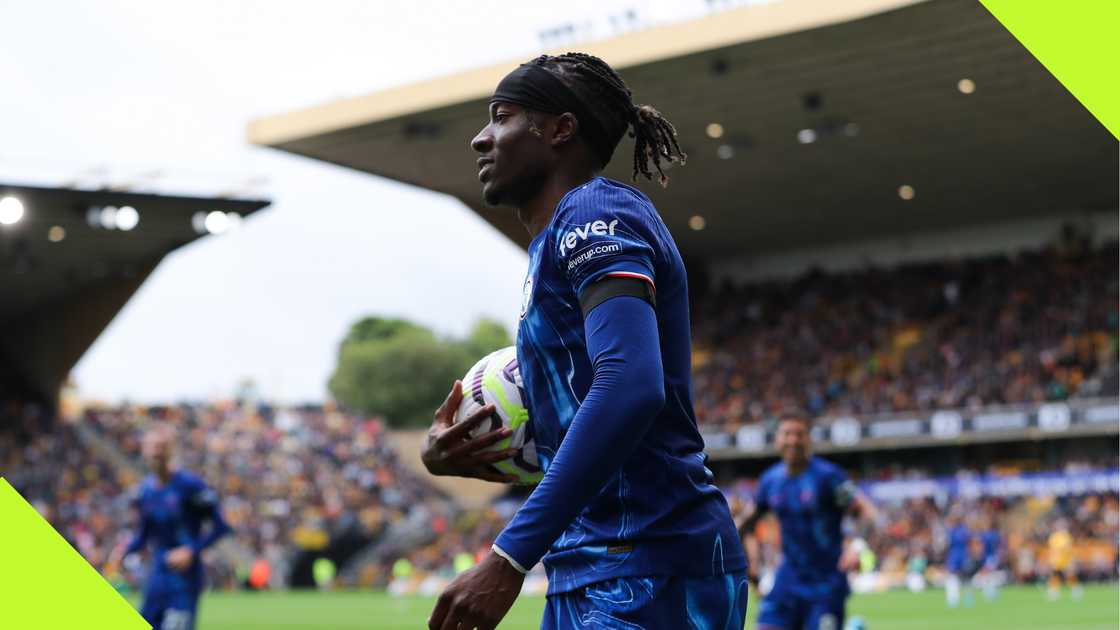 Noni Madueke with his match ball after scoring a hat trick for Chelsea against Wolves.