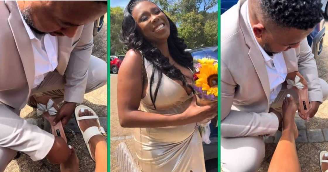 Husband helps wife put on shoes Husband helps wife put on shoes