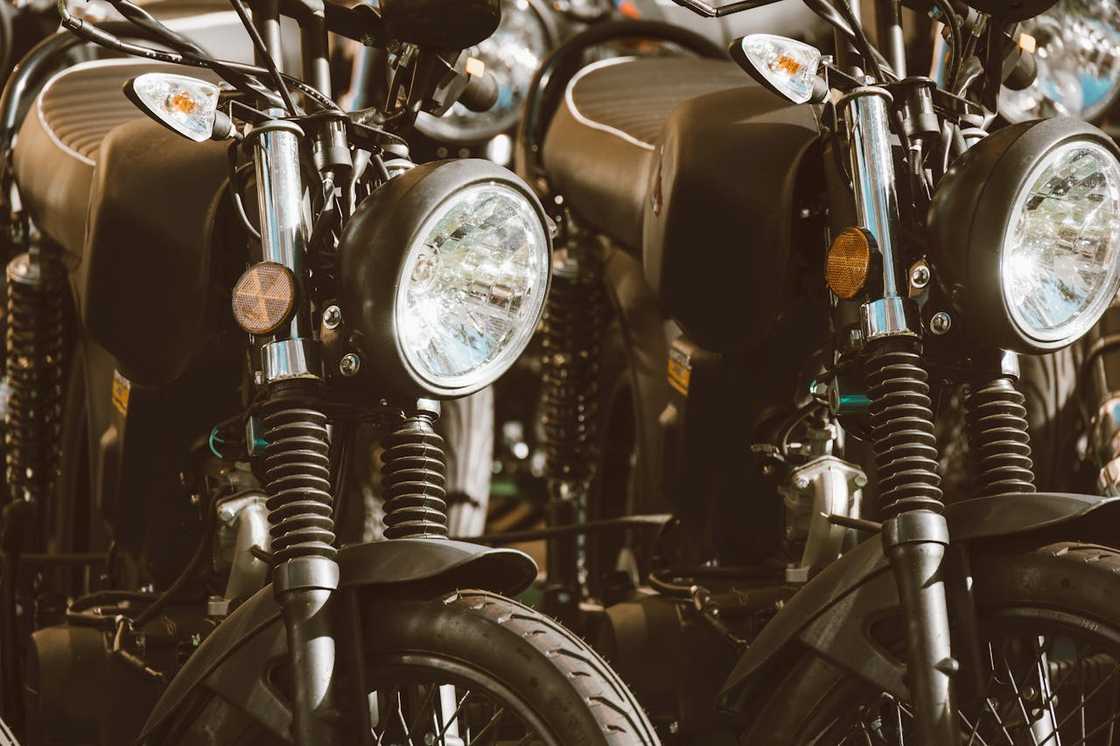 Row of classic black motorbikes parked closely together. Row of classic black motorbikes parked closely together.