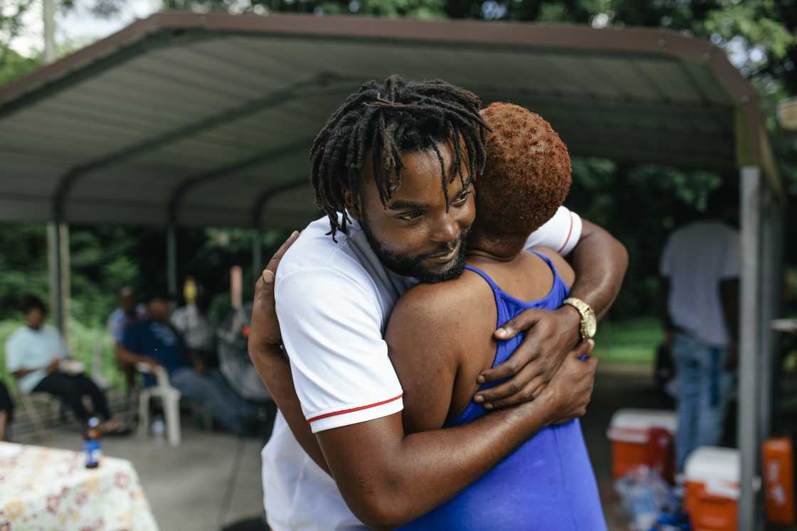 A mother and son hugging