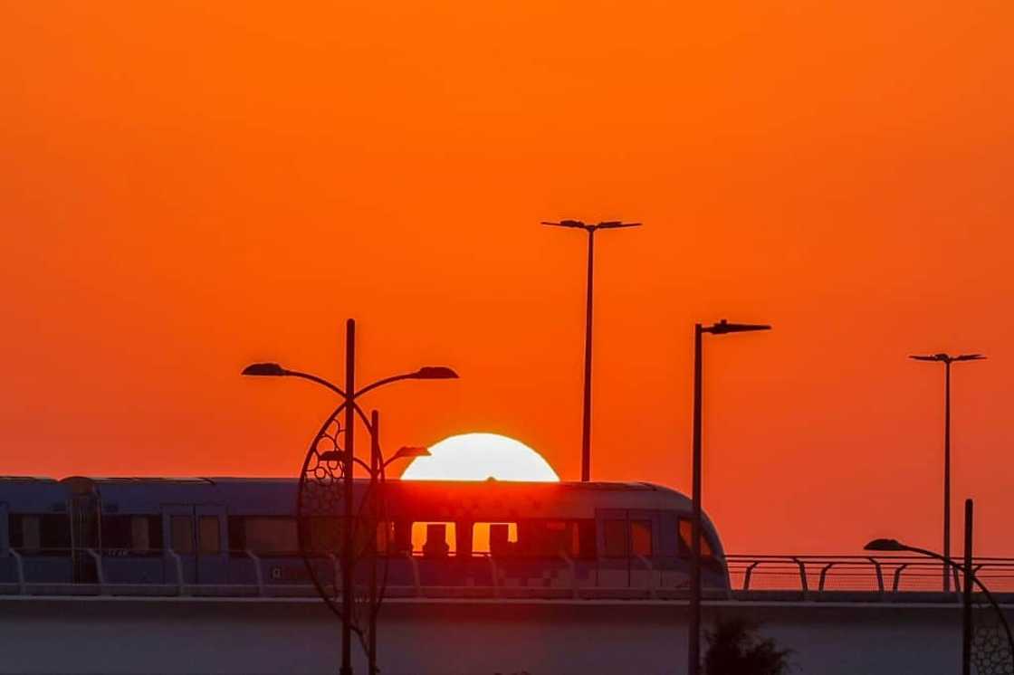 The sun rises at the COP28 climate talks on Wednesday, as negotiators thrash out the thorny issue of planet-heating fossil fuels