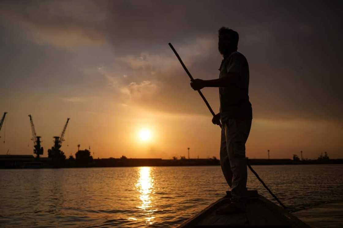 Sun setting on the Tigris: Iraqi fisherman Naim Haddad plys the Shatt al-Arab near Basra