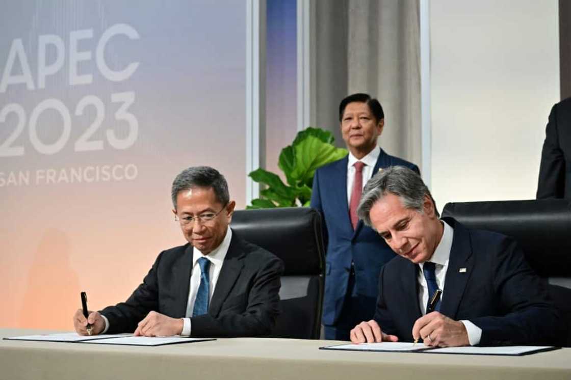 US Secretary of State Antony Blinken (R) and Philippines Secretary of Energy Raphael Lotilla sign a nuclear energy cooperation agreement in San Francisco, as Philippine President Ferdinand Marcos looks on US Secretary of State Antony Blinken (R) and Philippines Secretary of Energy Raphael Lotilla sign a nuclear energy cooperation agreement in San Francisco, as Philippine President Ferdinand Marcos looks on