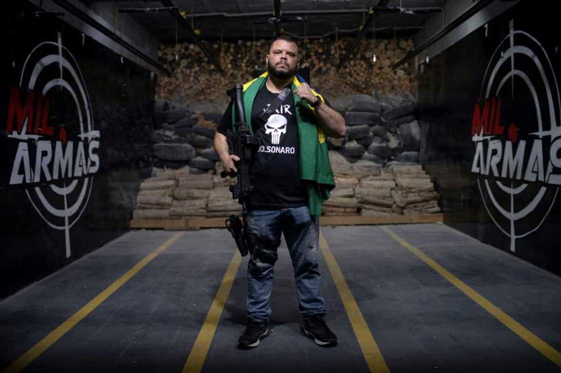 Ex-policeman Elitusalem Gomes Freitas is part of a booming demographic in President Jair Bolsonaro's Brazil: gun ownership has more than quintupled since the far-right president took office in 2019.