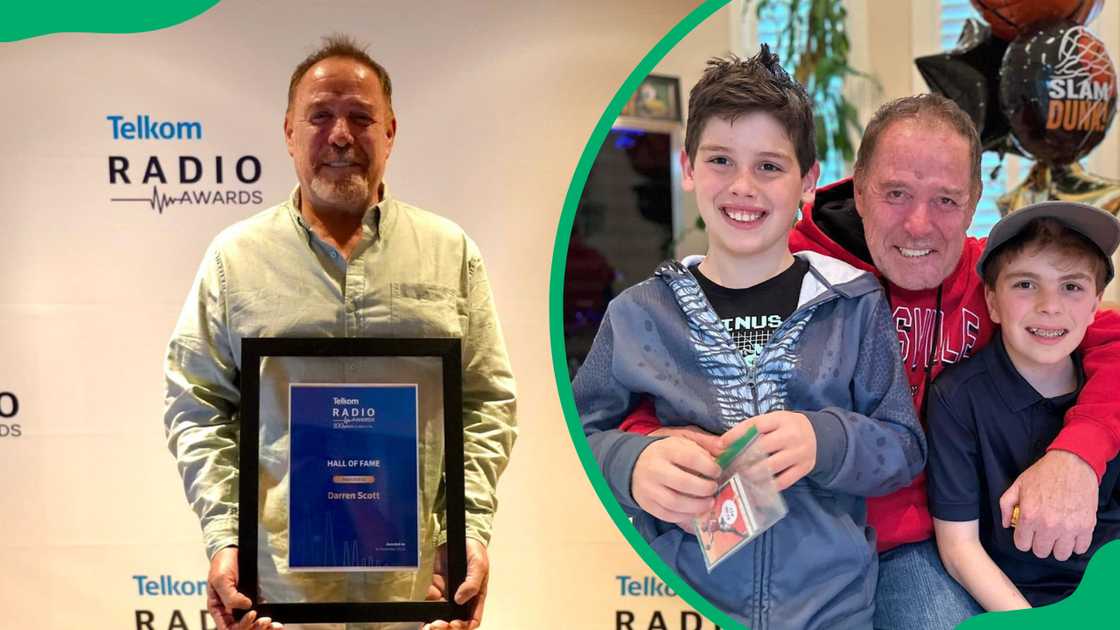 Darren Scott receives an award and posing for a photo with his sons Darren Scott receives an award and posing for a photo with his sons