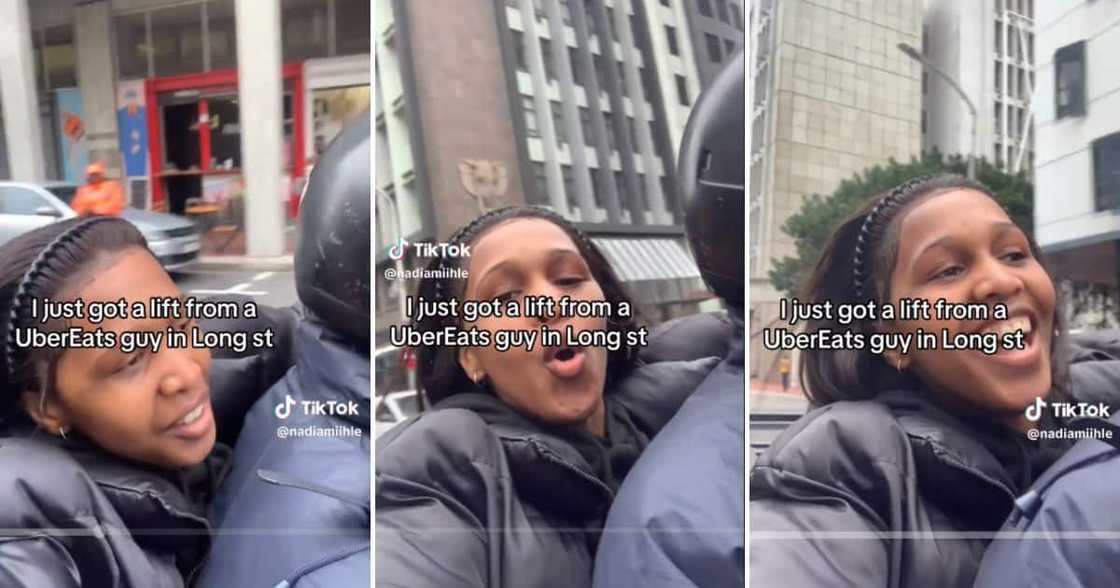 Woman catches ride on UberEats bike Woman catches ride on UberEats bike