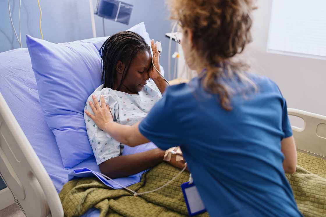 A woman sitting in a hospital bed