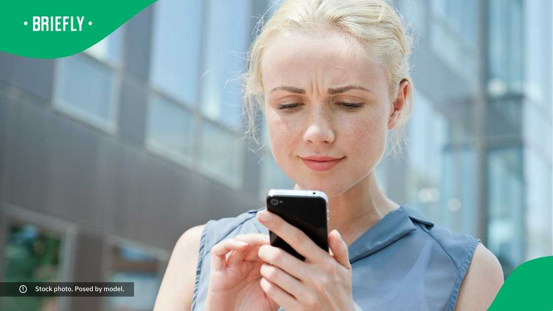 A woman looking at her phone.