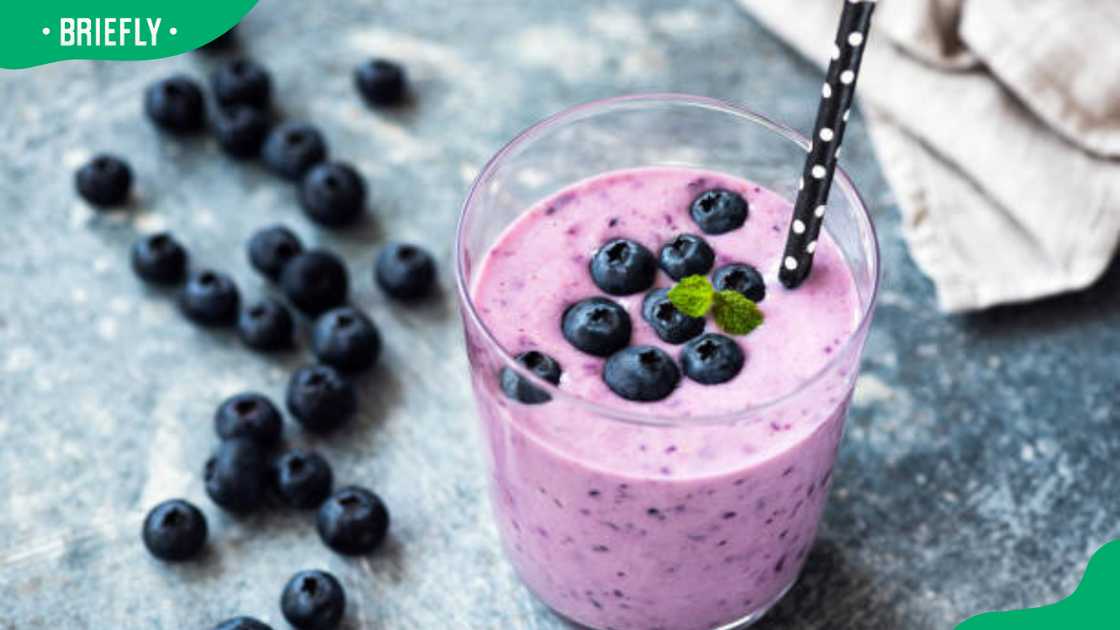 Tasty blueberry smoothie in glass