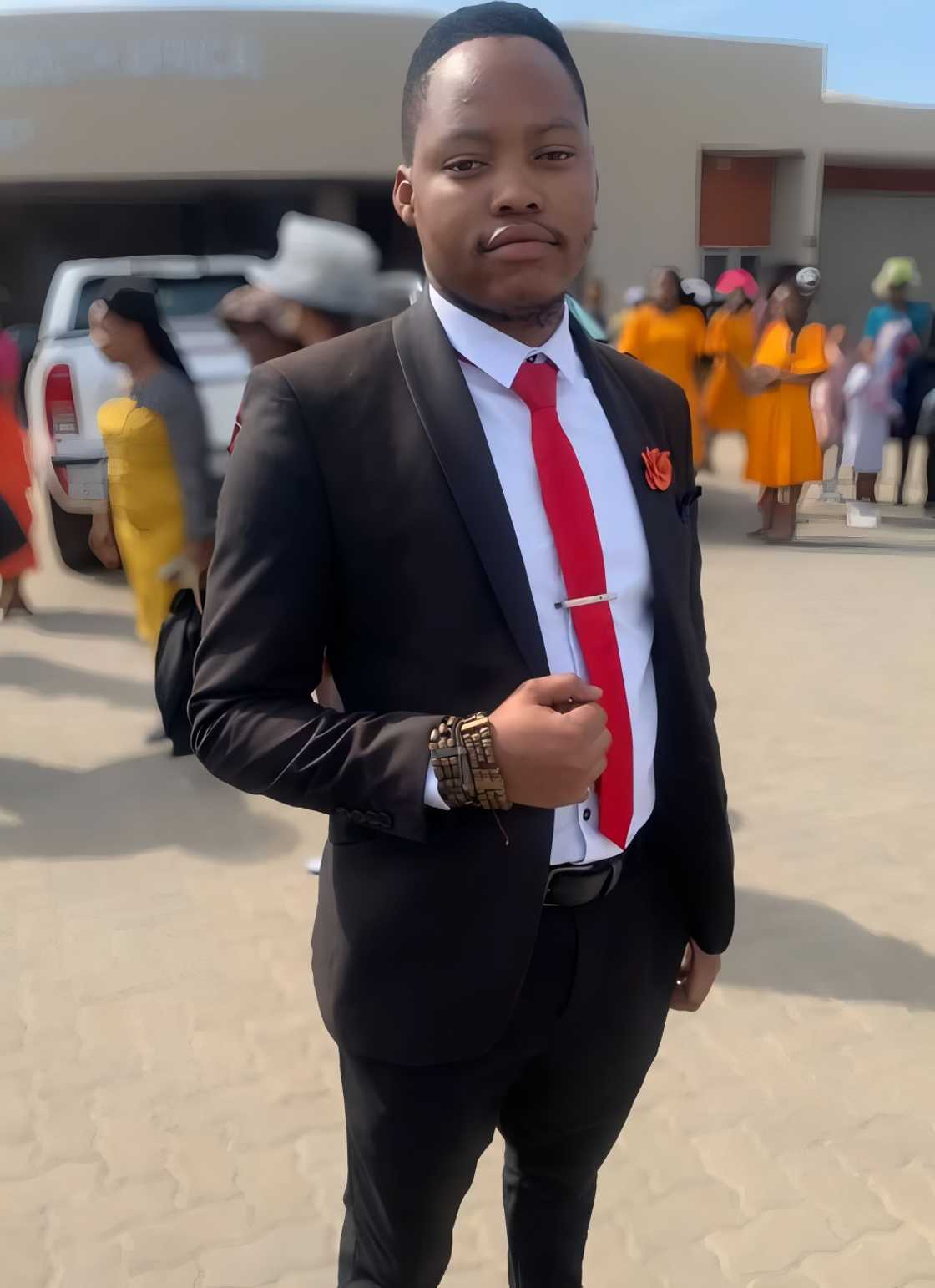 A man dressed in a black suit. A man dressed in a black suit.