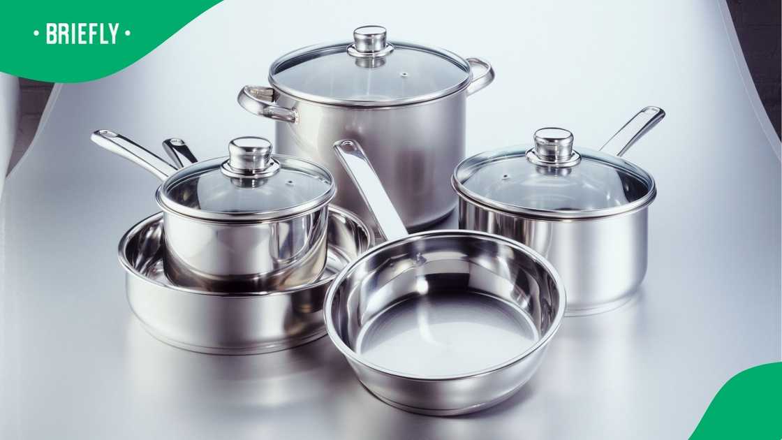 A stock photo of stainless steel pots and pans.