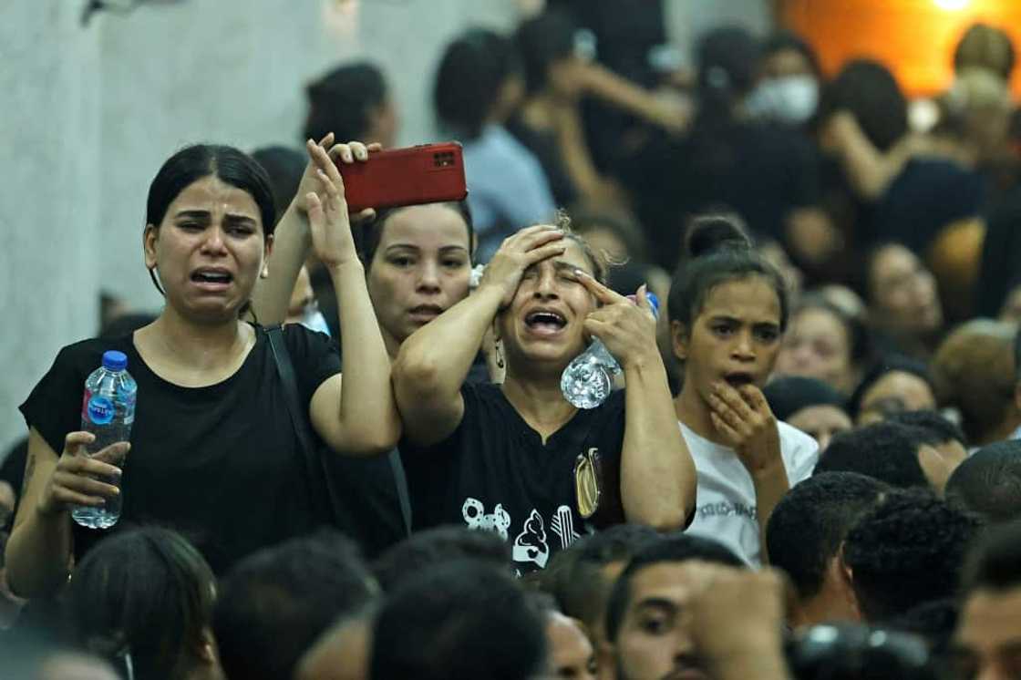 Mourners at the funeral of victims killed in Sunday's Coptic church fire in the Imbaba neighbourhood of greater Cairo Mourners at the funeral of victims killed in Sunday's Coptic church fire in the Imbaba neighbourhood of greater Cairo