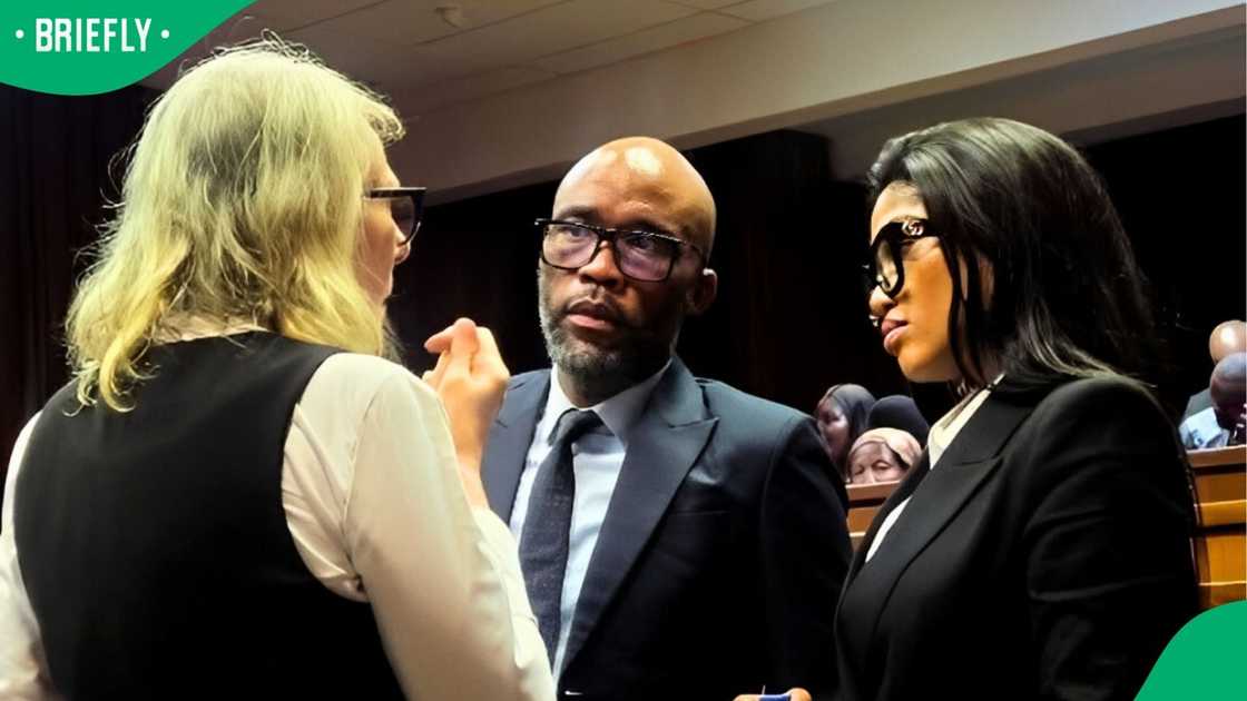 Advocate Annelene van den Heever talking to her clients Advocate Annelene van den Heever talking to her clients