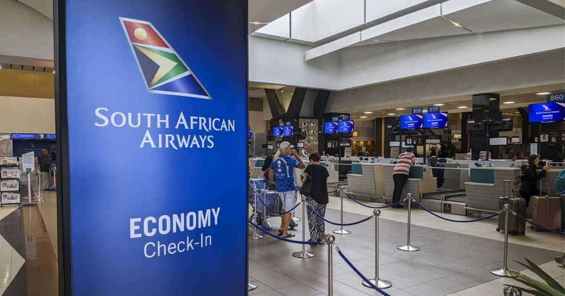 Passengers wait at the check-in counters for South African Airways (SAA), flights at OR Tambo International Airport in Johannesburg Passengers wait at the check-in counters for South African Airways (SAA), flights at OR Tambo International Airport in Johannesburg