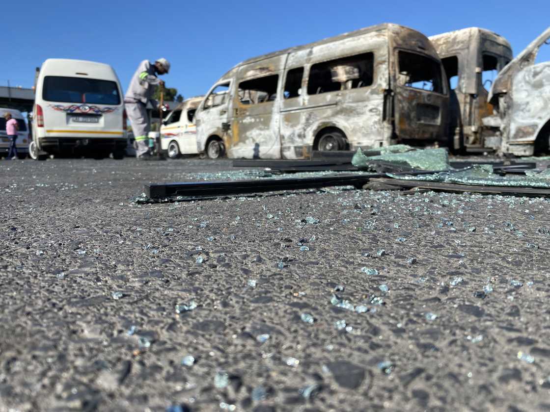 The shells of some taxis that were set alight. The shells of some taxis that were set alight.