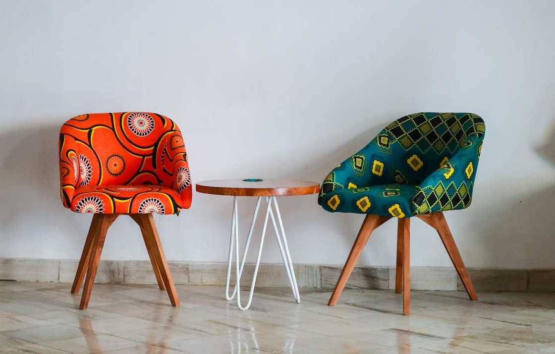 Two assorted colour padded chairs Two assorted colour padded chairs